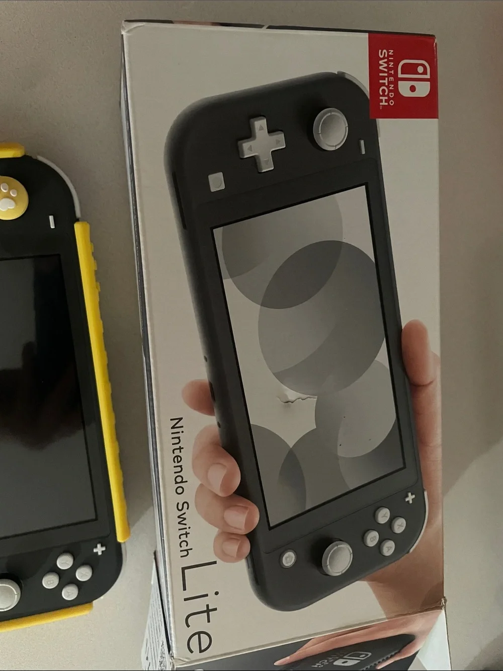 Nintendo Switch Lite Gray with Yellow Case with game